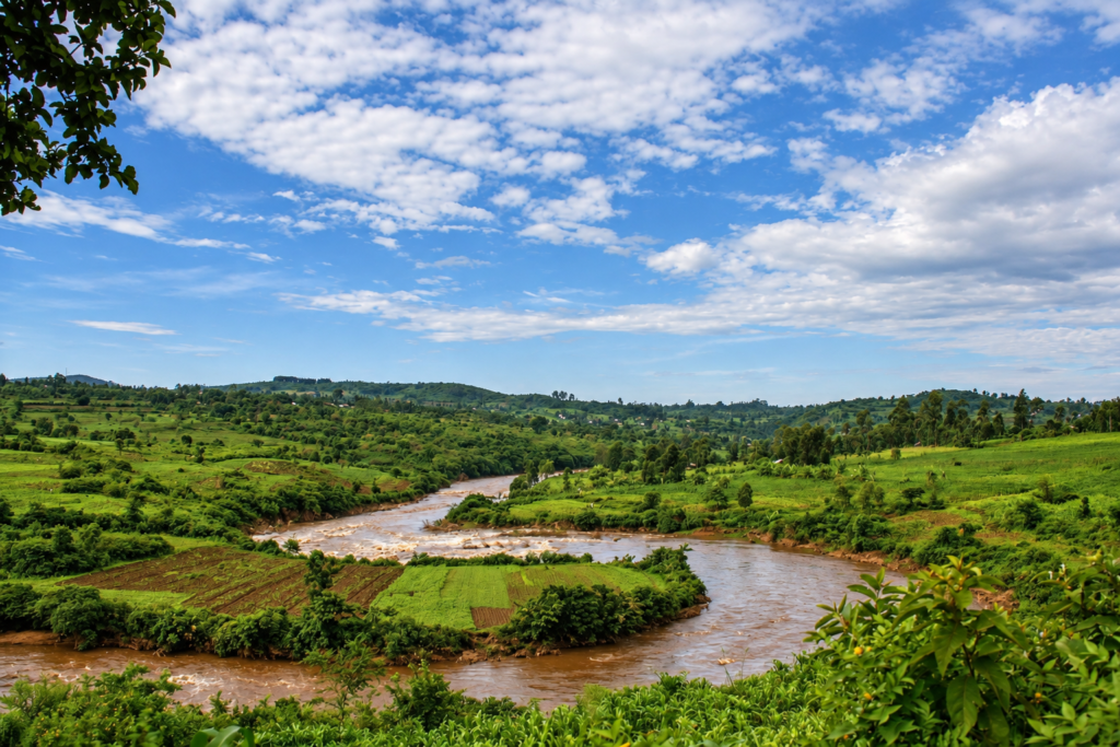 Digitally enhanced artistic rendering of the River Kuja landscape in western Kenya, showing green hills, riverside farmland and a broad blue sky